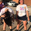 Savanna Sullivan, right, recuperates briefly after running in the October 23 Color Run that she helped to plan.