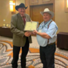 JC Mathiews was presented his 30 year plaque for board of director at the 83rd Texas Soil and Water Conservation Annual meeting in Fort Worth No- vember 1. He is pictured receiving the award from John Tate, State Director of District V Texas Associ- ation of Soil and Water Conservation Districts